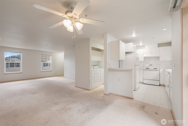 1160 Monroe Ave NE Unit B-4, Renton, WA 98056 - unfurnished living room featuring light carpet, separate washer and dryer, ceiling fan, and recessed lighting
