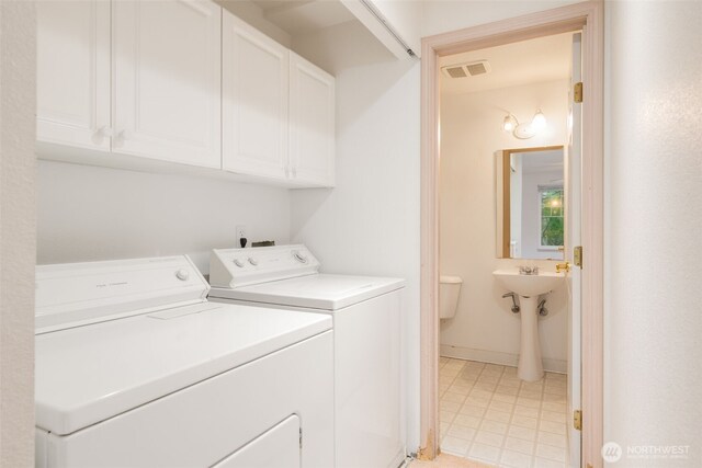 1160 Monroe Ave NE Unit B-4, Renton, WA 98056 - washroom featuring cabinet space and independent washer and dryer