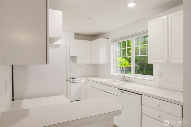 1160 Monroe Ave NE Unit B-4, Renton, WA 98056 - kitchen with white appliances, white cabinets, light countertops, and recessed lighting