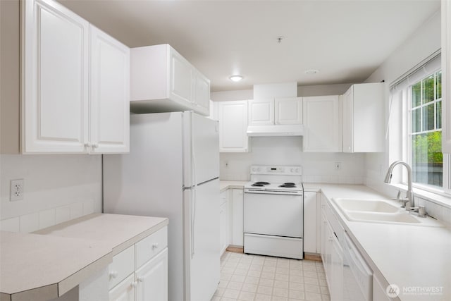1160 Monroe Ave NE Unit B-4, Renton, WA 98056 - kitchen with white appliances, under cabinet range hood, white cabinetry, and light countertops