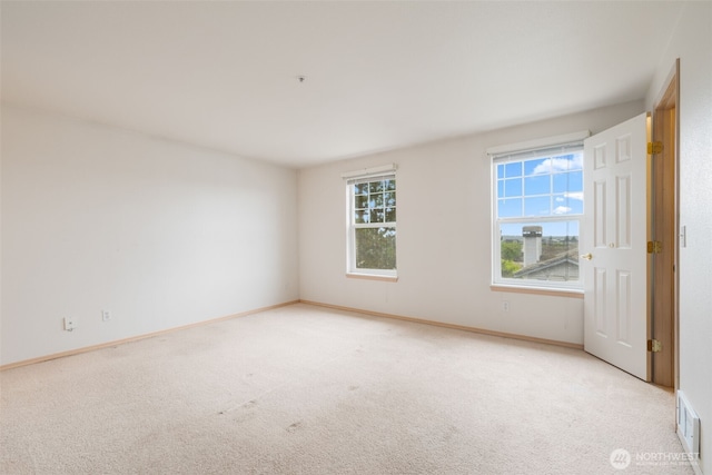 1160 Monroe Ave NE Unit B-4, Renton, WA 98056 - carpeted empty room with baseboards