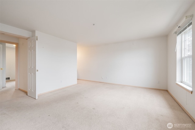 1160 Monroe Ave NE Unit B-4, Renton, WA 98056 - unfurnished room with light colored carpet and healthy amount of natural light