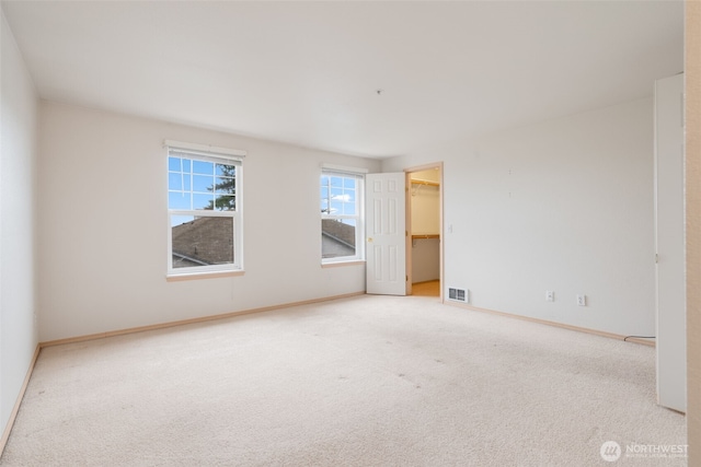 1160 Monroe Ave NE Unit B-4, Renton, WA 98056 - carpeted empty room with baseboards