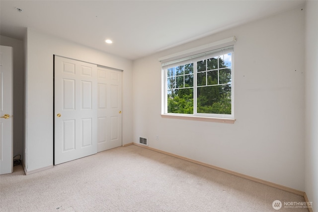 1160 Monroe Ave NE Unit B-4, Renton, WA 98056 - unfurnished bedroom with carpet, a closet, and recessed lighting