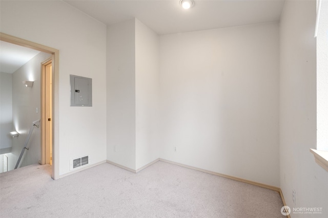 1160 Monroe Ave NE Unit B-4, Renton, WA 98056 - carpeted empty room featuring electric panel and baseboards