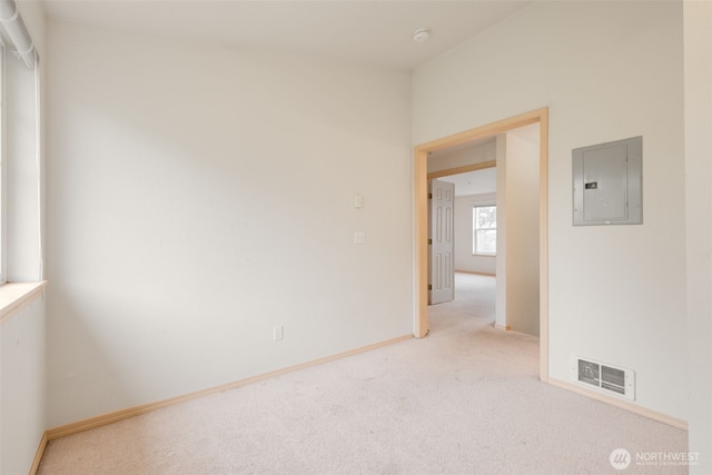 1160 Monroe Ave NE Unit B-4, Renton, WA 98056 - unfurnished room featuring electric panel, light carpet, and a smoke detector