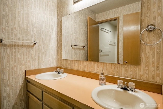 1117 W Racine St, Bellingham, WA 98229 - bathroom with wallpapered walls and double vanity