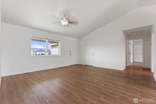 1325 W Polo Ridge Dr, Moses Lake, WA 98837 - unfurnished room featuring vaulted ceiling, a ceiling fan, and wood finished floors