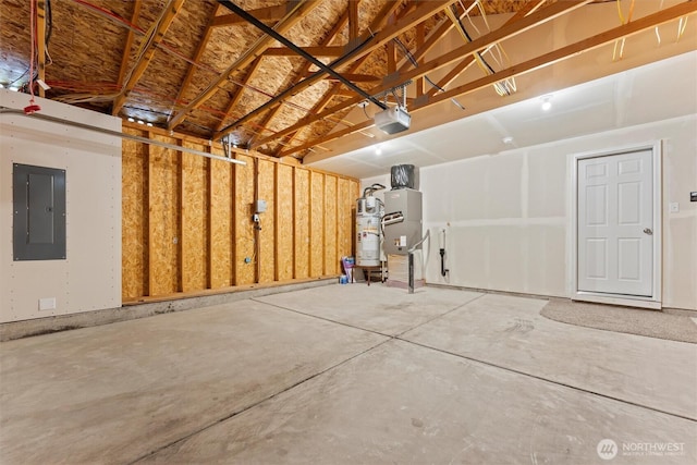 1325 W Polo Ridge Dr, Moses Lake, WA 98837 - garage with electric panel, a garage door opener, and water heater