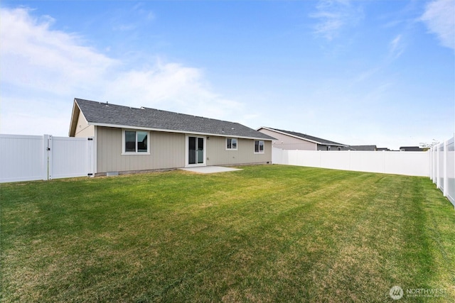 1325 W Polo Ridge Dr, Moses Lake, WA 98837 - back of property with a fenced backyard and a patio