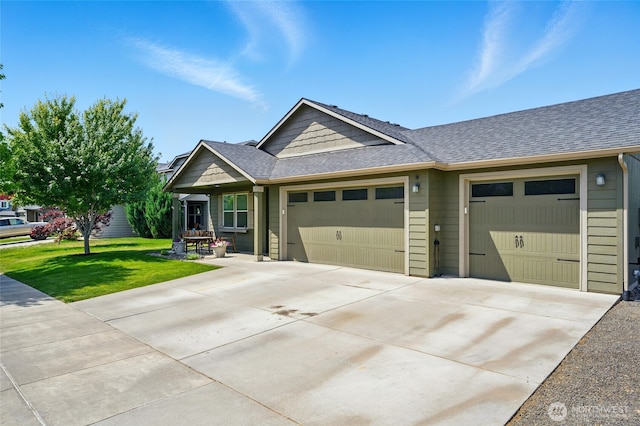 2134 Alco Ave, Walla Walla, WA 99362 - view of front of home with an attached garage, a front yard, concrete driveway, and roof with shingles