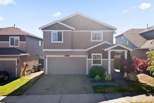 6672 Udall Pl SE, Auburn, WA 98092 - view of front of house featuring a garage, board and batten siding, and asphalt driveway