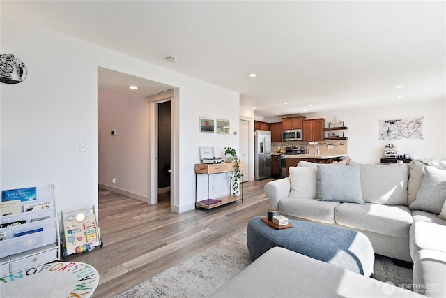 6672 Udall Pl SE, Auburn, WA 98092 - living room featuring light wood finished floors and recessed lighting