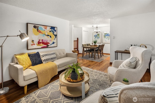 4727 W Lake Sammamish Pkwy SE Unit B-106, Issaquah, WA 98027 - living room with wood finished floors, a chandelier, and a textured ceiling