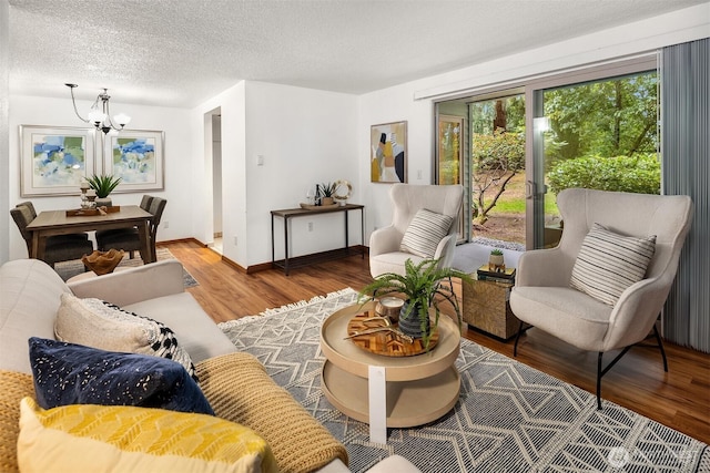 4727 W Lake Sammamish Pkwy SE Unit B-106, Issaquah, WA 98027 - living room featuring a chandelier, wood finished floors, and a textured ceiling