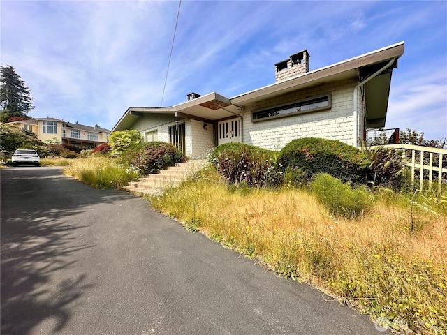 1445 SW 296th St, Federal Way, WA 98023 - view of front of home with a chimney and brick siding