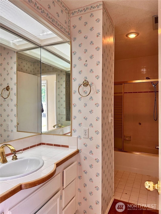 1445 SW 296th St, Federal Way, WA 98023 - full bathroom featuring wallpapered walls, vanity, bath / shower combo with glass door, and tile patterned flooring