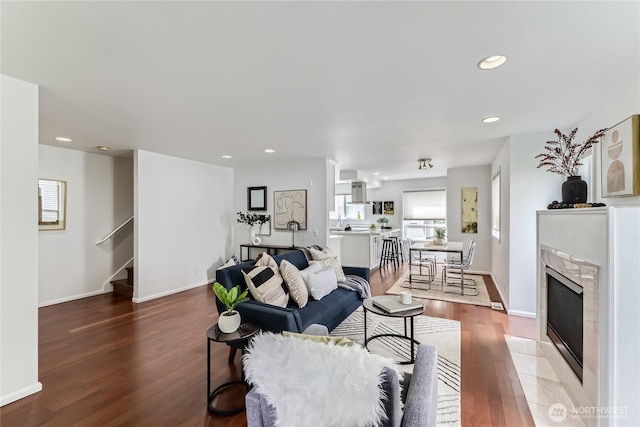 2801 NE 130th St Unit C101, Seattle, WA 98125 - living area with wood finished floors, stairs, recessed lighting, and a premium fireplace