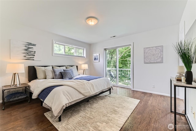 2801 NE 130th St Unit C101, Seattle, WA 98125 - bedroom featuring access to outside and dark wood finished floors