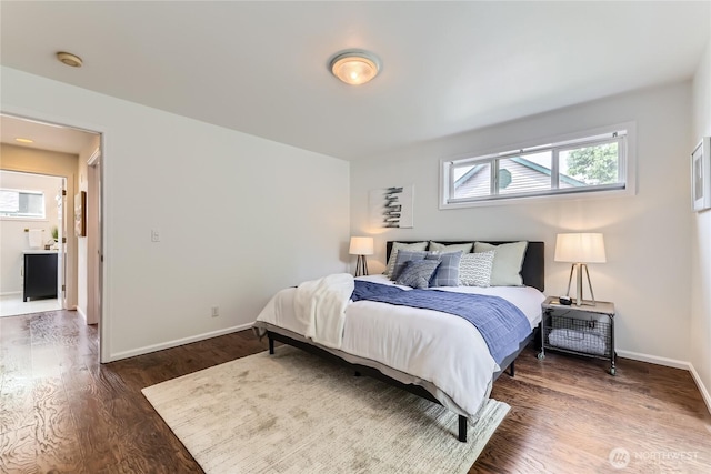 2801 NE 130th St Unit C101, Seattle, WA 98125 - bedroom featuring baseboards and wood finished floors