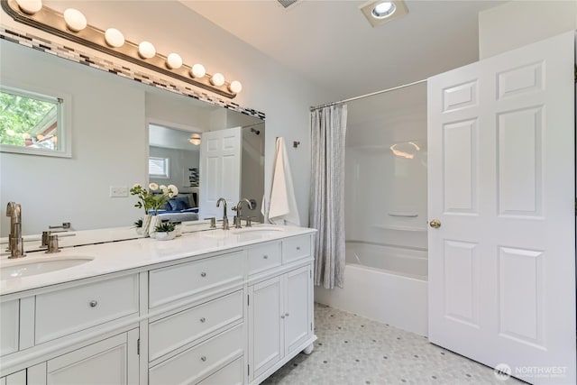 2801 NE 130th St Unit C101, Seattle, WA 98125 - ensuite bathroom with double vanity and shower / bathtub combination with curtain
