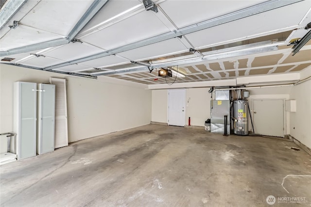 2801 NE 130th St Unit C101, Seattle, WA 98125 - garage with gas water heater, a garage door opener, and refrigerator