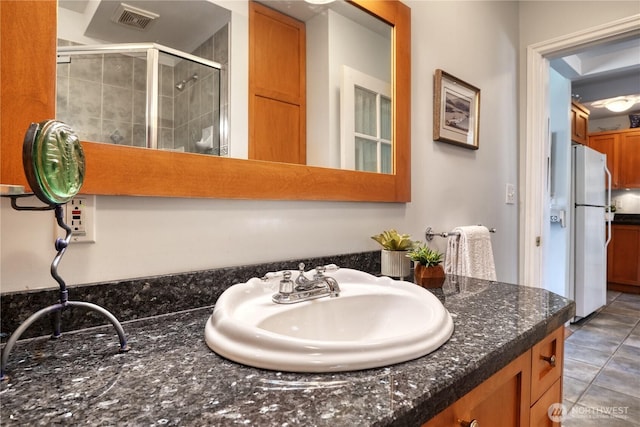 2111 Maple St, Point Roberts, WA 98281 - full bath with vanity, a stall shower, and tile patterned flooring