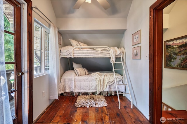 2111 Maple St, Point Roberts, WA 98281 - bedroom featuring wood-type flooring, multiple windows, vaulted ceiling, and a ceiling fan