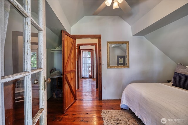 2111 Maple St, Point Roberts, WA 98281 - bedroom with vaulted ceiling, wood-type flooring, multiple windows, and ceiling fan