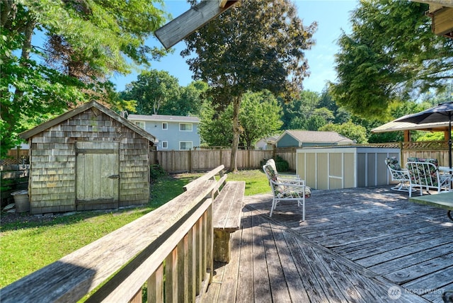 2111 Maple St, Point Roberts, WA 98281 - wooden deck featuring a storage unit and a fenced backyard