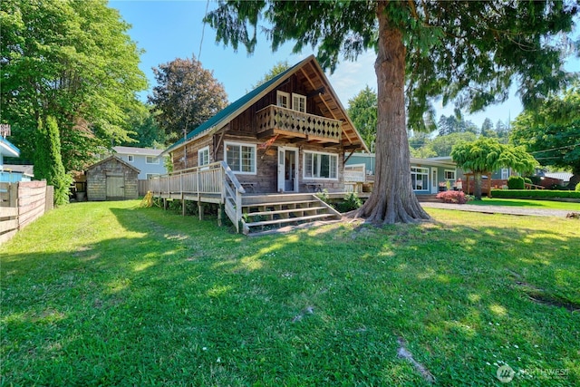 2111 Maple St, Point Roberts, WA 98281 - back of property with a storage unit, a deck, and stone siding