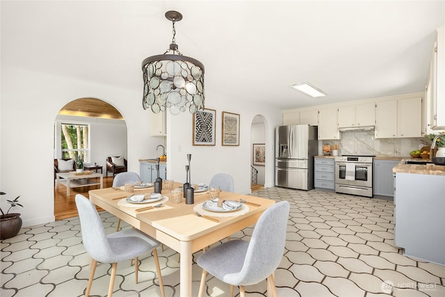 10376 NE Winthers Rd, Bainbridge Island, WA 98110 - dining room with arched walkways and light floors