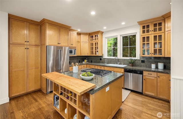 473 Glen Hollow Pl SW, Bainbridge Island, WA 98110 - kitchen featuring appliances with stainless steel finishes, light wood-type flooring, tasteful backsplash, and recessed lighting