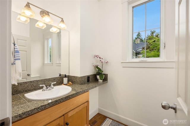 473 Glen Hollow Pl SW, Bainbridge Island, WA 98110 - half bathroom with baseboards and vanity