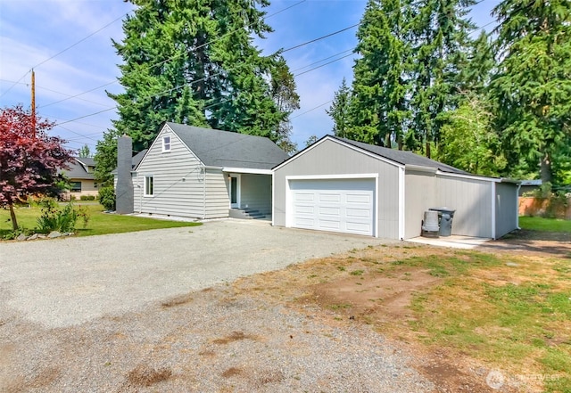 318 Mill Ave SE, Orting, WA 98360 - garage featuring dirt driveway