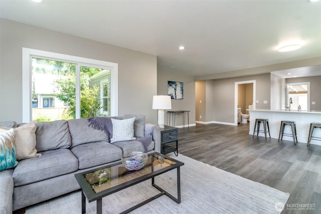 318 Mill Ave SE, Orting, WA 98360 - living room featuring dark wood-style floors and recessed lighting