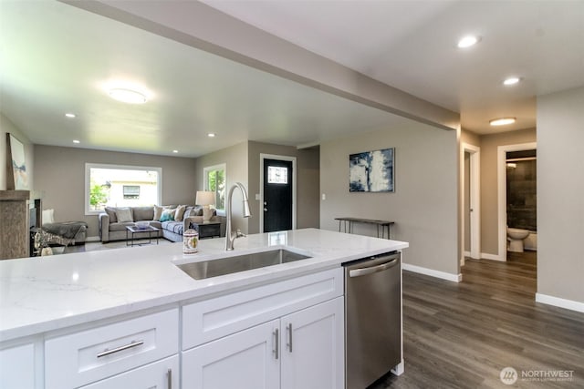 318 Mill Ave SE, Orting, WA 98360 - kitchen with dishwasher, white cabinets, open floor plan, dark wood finished floors, and recessed lighting
