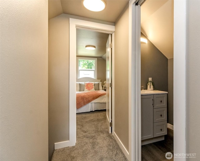 318 Mill Ave SE, Orting, WA 98360 - corridor with lofted ceiling and dark carpet