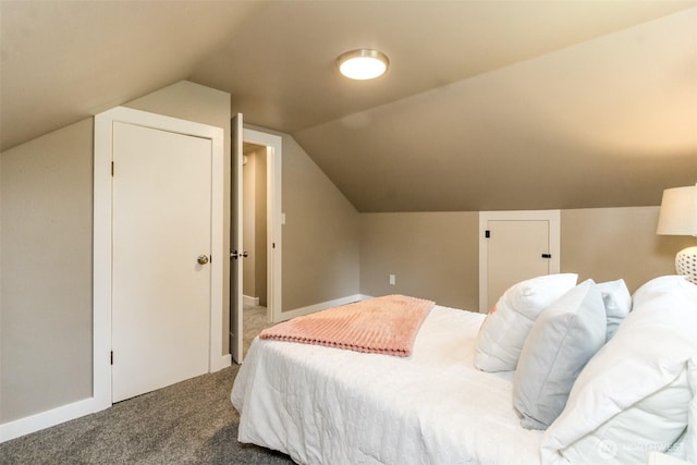 318 Mill Ave SE, Orting, WA 98360 - carpeted bedroom with vaulted ceiling and baseboards