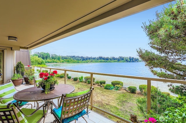 9727 NE Juanita Dr Unit 201, Kirkland, WA 98034 - balcony featuring a water view and outdoor dining space