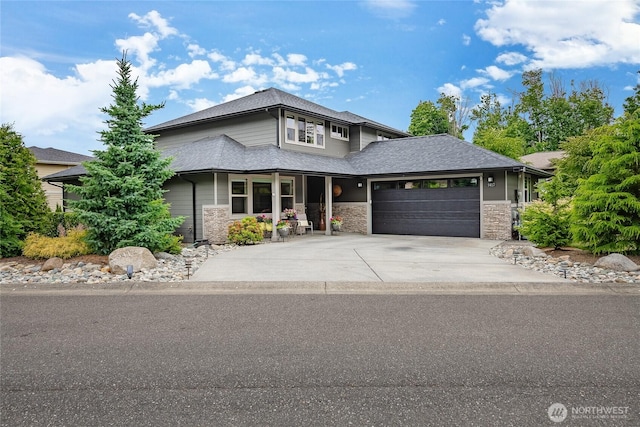 5417 Ocean Mist Loop, Blaine, WA 98230 - prairie-style home featuring a garage, driveway, a porch, and stone siding