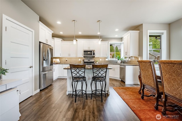 5417 Ocean Mist Loop, Blaine, WA 98230 - kitchen with appliances with stainless steel finishes, a center island, white cabinets, and recessed lighting