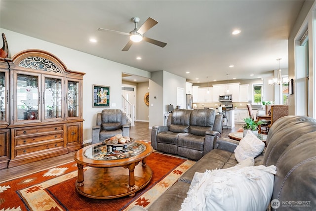 5417 Ocean Mist Loop, Blaine, WA 98230 - living area with a ceiling fan, light wood-style flooring, recessed lighting, and a chandelier
