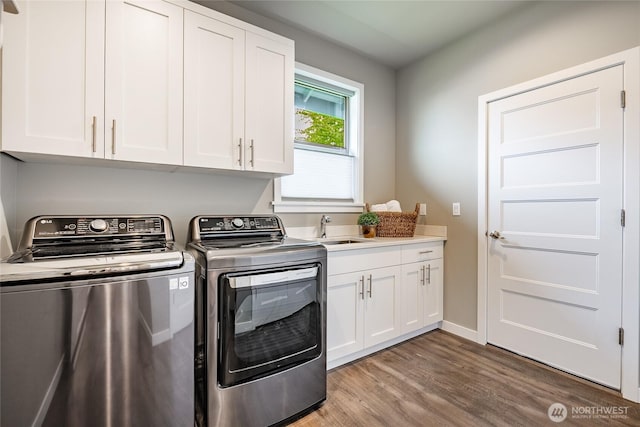 5417 Ocean Mist Loop, Blaine, WA 98230 - laundry room featuring separate washer and dryer, cabinet space, and wood finished floors