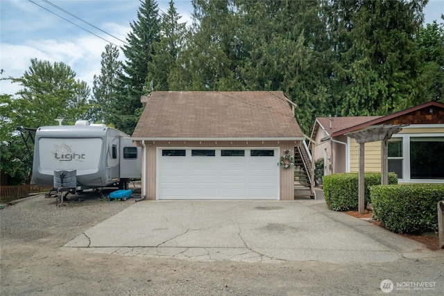 118 W Winesap Rd, Bothell, WA 98012 - view of front of home featuring roof with shingles, a garage, stairs, and driveway