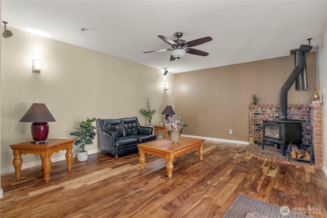 118 W Winesap Rd, Bothell, WA 98012 - living room with a wood stove, wood finished floors, and ceiling fan