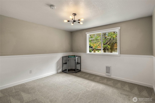 118 W Winesap Rd, Bothell, WA 98012 - unfurnished room featuring a smoke detector, a chandelier, carpet flooring, and a textured ceiling