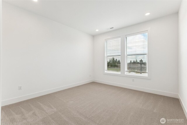 8517 137th Ave SE Unit 1, Newcastle, WA 98059 - unfurnished room featuring light colored carpet and recessed lighting