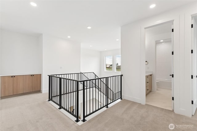 8517 137th Ave SE Unit 1, Newcastle, WA 98059 - corridor featuring an upstairs landing, light colored carpet, and recessed lighting