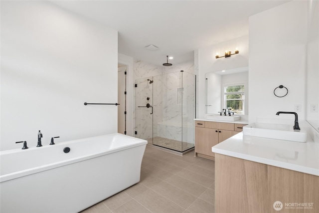 8517 137th Ave SE Unit 1, Newcastle, WA 98059 - full bathroom with a marble finish shower, two vanities, a soaking tub, and tile patterned flooring